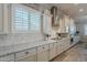 Modern kitchen with granite countertops and stainless steel range at 10110 W Redbird Rd, Peoria, AZ 85383