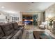 Spacious living room with sliding doors opening to a view of the pool and patio at 10110 W Redbird Rd, Peoria, AZ 85383