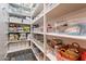 Well-organized pantry with ample shelving for storage at 10110 W Redbird Rd, Peoria, AZ 85383