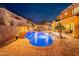 Luxury pool with water features and fire pit at 10110 W Redbird Rd, Peoria, AZ 85383