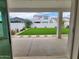 Covered patio overlooking a well-manicured lawn at 10150 E Thistle Ave, Mesa, AZ 85212