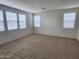 Bright bonus room featuring carpet and multiple windows at 10150 E Thistle Ave, Mesa, AZ 85212