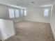 Spacious bonus room with neutral carpeting and large windows at 10150 E Thistle Ave, Mesa, AZ 85212