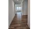 Bright hallway with wood-look floors leading to living spaces at 10150 E Thistle Ave, Mesa, AZ 85212