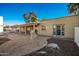 Landscaped backyard with patio, fireplace and mature trees at 102 W El Caminito Dr, Phoenix, AZ 85021