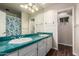 Clean bathroom with teal countertops and shower at 102 W El Caminito Dr, Phoenix, AZ 85021