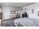 Bright bedroom with striped bedding and gray carpet at 102 W El Caminito Dr, Phoenix, AZ 85021