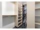 Large walk-in closet with shelving and hanging rods at 102 W El Caminito Dr, Phoenix, AZ 85021