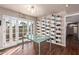 Bright dining area with glass-top table and French doors leading to the backyard at 102 W El Caminito Dr, Phoenix, AZ 85021