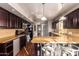 Modern kitchen with dark wood cabinets and granite counters at 102 W El Caminito Dr, Phoenix, AZ 85021