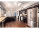 Modern kitchen with dark wood cabinets and granite counters at 102 W El Caminito Dr, Phoenix, AZ 85021