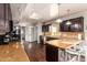 Modern kitchen with dark wood cabinets and granite counters at 102 W El Caminito Dr, Phoenix, AZ 85021