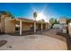 Large backyard patio with covered seating and outdoor fireplace at 102 W El Caminito Dr, Phoenix, AZ 85021