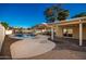 Private backyard oasis with pool, patio, and covered seating area at 102 W El Caminito Dr, Phoenix, AZ 85021