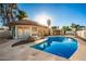 Inviting kidney-shaped pool with a covered patio at 102 W El Caminito Dr, Phoenix, AZ 85021