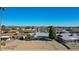 Aerial view of the back of the house, showing the patio and surrounding neighborhood at 10629 W Willow Creek Cir, Sun City, AZ 85373