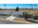 Single story home with gray roof and white exterior, located near a golf course at 10629 W Willow Creek Cir, Sun City, AZ 85373