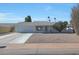 Single story home with gray roof, white exterior, and gravel landscaping at 10629 W Willow Creek Cir, Sun City, AZ 85373