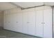 Garage with ample storage cabinets at 10629 W Willow Creek Cir, Sun City, AZ 85373