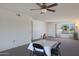 Living room with golf course view and dining area at 10629 W Willow Creek Cir, Sun City, AZ 85373