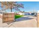 Backyard entry with wooden gate and gravel driveway at 10902 W Flanagan St, Avondale, AZ 85323