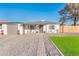 Modern home with gray driveway and landscaped lawn at 10902 W Flanagan St, Avondale, AZ 85323