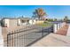 Home with a gated entry and artificial turf in the backyard at 10902 W Flanagan St, Avondale, AZ 85323