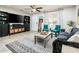 Spacious living room with gray couch and teal accent chairs at 10902 W Flanagan St, Avondale, AZ 85323