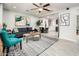 Bright and airy living room with a view into the kitchen and dining area at 10902 W Flanagan St, Avondale, AZ 85323