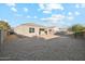 Spacious backyard with gravel and partial view of house at 11225 E Marigold Ln, Florence, AZ 85132