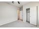 Simple bedroom with carpet, ceiling fan, and double door closet at 11225 E Marigold Ln, Florence, AZ 85132