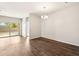 Simple dining area with hardwood floors and a chandelier at 11225 E Marigold Ln, Florence, AZ 85132