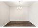 Bright dining room features dark wood-look floors and a modern light fixture at 11225 E Marigold Ln, Florence, AZ 85132