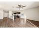 Open concept kitchen with dark cabinetry and quartz countertops at 11225 E Marigold Ln, Florence, AZ 85132