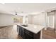 Open concept kitchen with island, stainless steel appliances, and quartz countertops at 11225 E Marigold Ln, Florence, AZ 85132