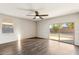 Bright and airy living room with sliding glass doors and wood-look floors at 11225 E Marigold Ln, Florence, AZ 85132