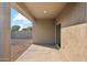 Covered patio with sliding glass doors and backyard access at 11225 E Marigold Ln, Florence, AZ 85132