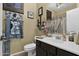 Clean bathroom with vanity, toilet and shower/tub combo at 1161 S Storment Ln, Gilbert, AZ 85296