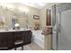 Elegant bathroom with double vanity, soaking tub, and walk-in shower at 1161 S Storment Ln, Gilbert, AZ 85296