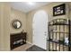 Elegant entryway with decorative mirror and a wine rack at 1161 S Storment Ln, Gilbert, AZ 85296