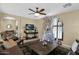 Bright and airy living room with a large Christmas tree at 1161 S Storment Ln, Gilbert, AZ 85296