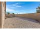 Spacious backyard with gravel, artificial turf, and wall at 1361 E Martha Dr, Casa Grande, AZ 85122