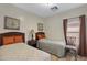 Bedroom with twin beds and nightstands at 1361 E Martha Dr, Casa Grande, AZ 85122