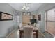 Bright dining room features a granite table with four chairs and large windows at 1361 E Martha Dr, Casa Grande, AZ 85122