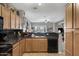 Kitchen with dark countertops and wood cabinets at 1361 E Martha Dr, Casa Grande, AZ 85122