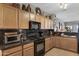 Kitchen with dark countertops and wood cabinets at 1361 E Martha Dr, Casa Grande, AZ 85122