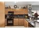 Kitchen with dark countertops and wood cabinets at 1361 E Martha Dr, Casa Grande, AZ 85122