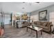 Living room with hardwood floors and comfortable seating at 1361 E Martha Dr, Casa Grande, AZ 85122