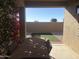 Relaxing patio with table, chairs, and view of backyard at 1361 E Martha Dr, Casa Grande, AZ 85122