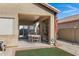 Covered patio with seating area and lush landscaping at 1361 E Martha Dr, Casa Grande, AZ 85122